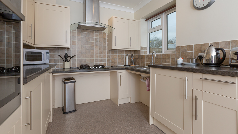 Family friendly accessible kitchen with access for wheelchair at the hob and sink
