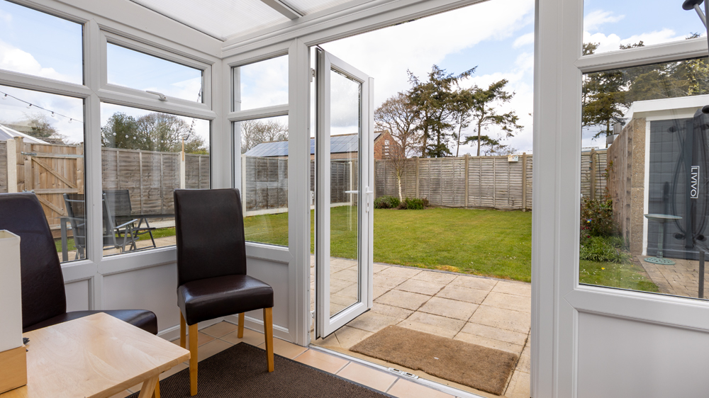 Small conservatory to sit and relax in and enjoy the garden or time away from each other.
