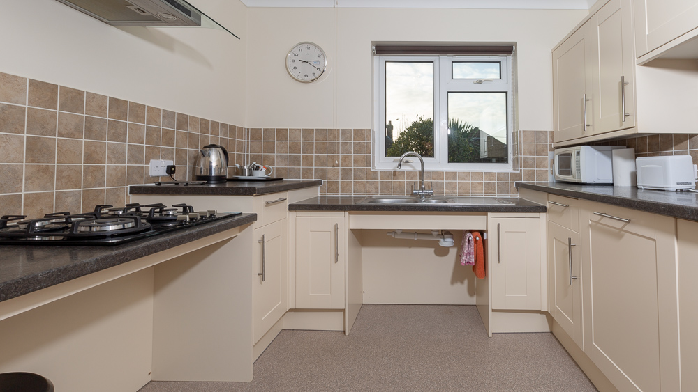 Little Bench kitchen with space under the sink and oven for wheelchair access.
