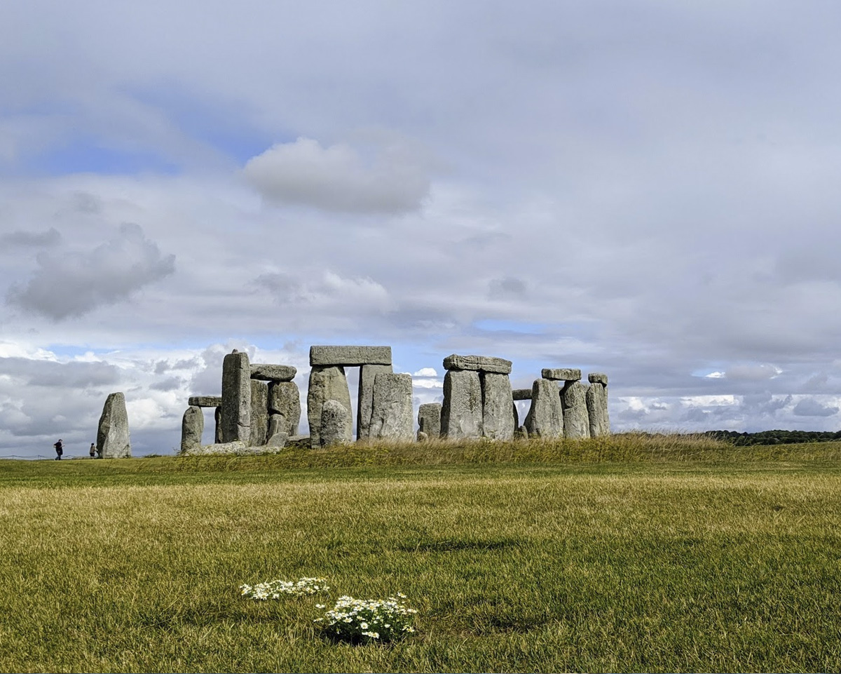 Stonehenge standing stones under a dramatic sky in August 2020