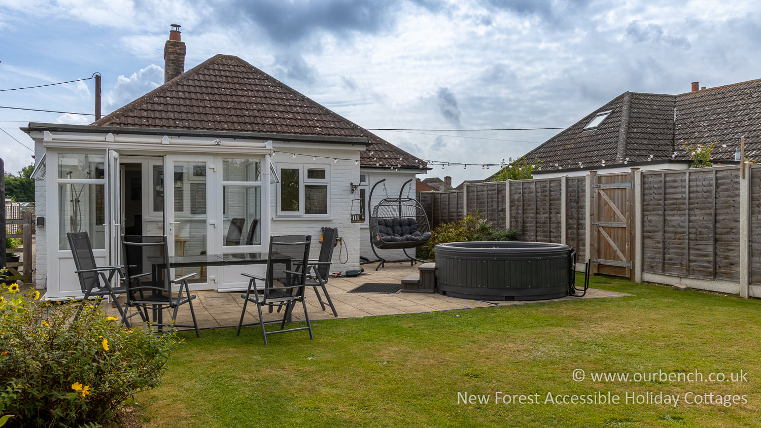 Hot tub set up on the patio at Garden Bench accessible holiday cottage