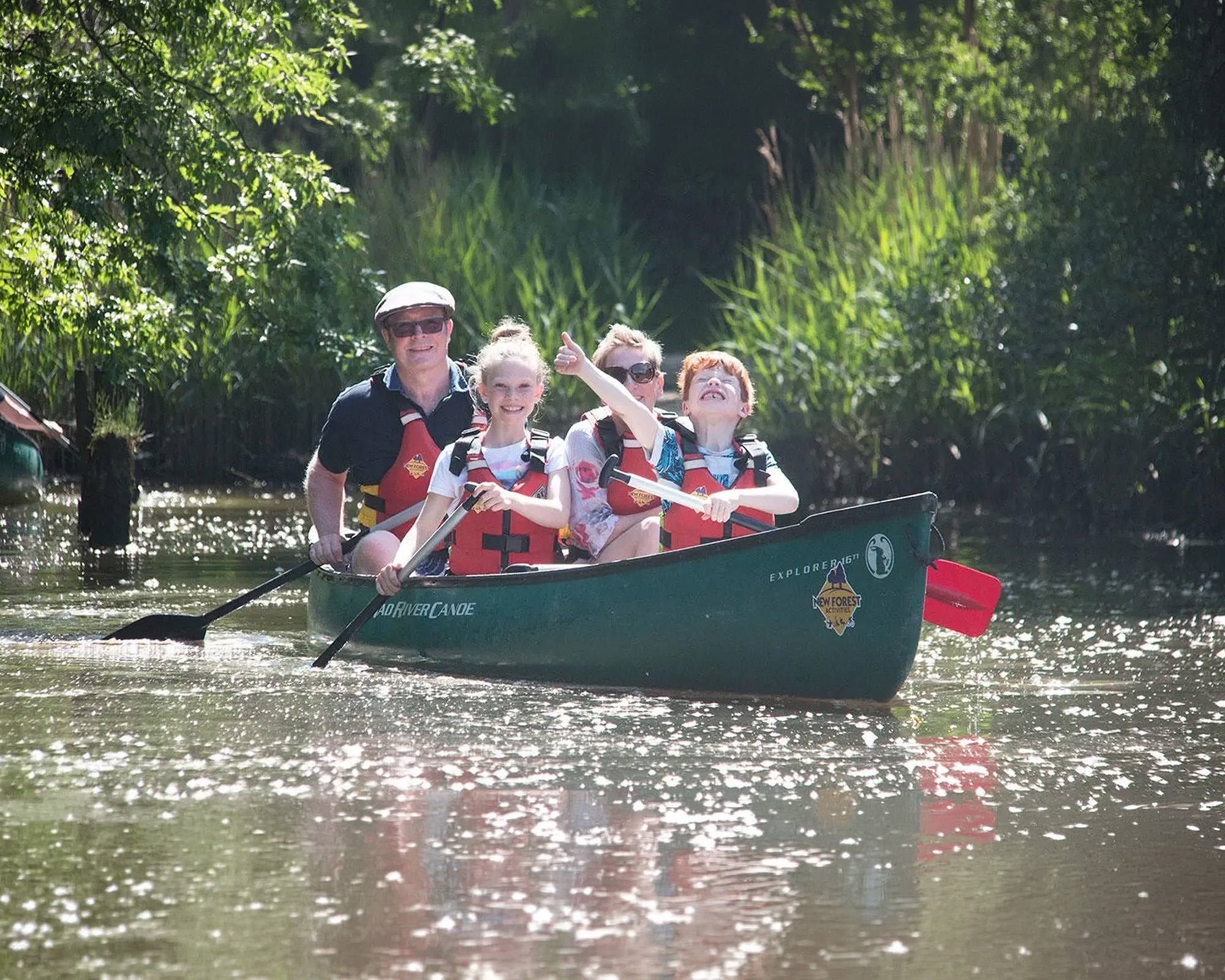 A family enjoying canoeing on Beaulieu River together